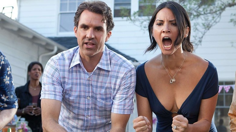 Paul Schneider and Olivia Munn yelling