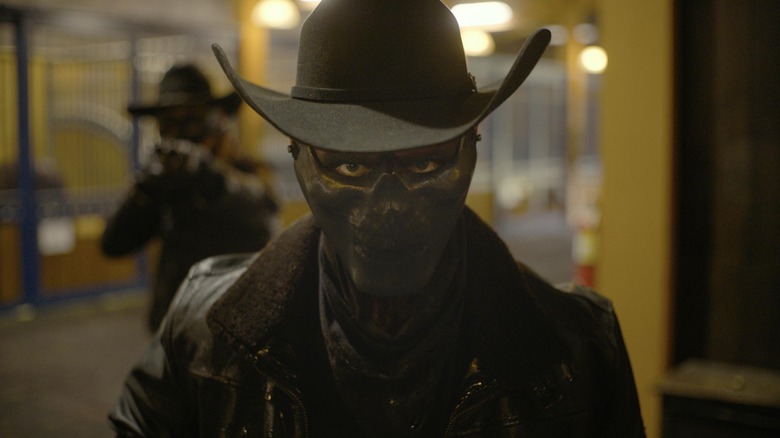 Masked killer in a cowboy hat