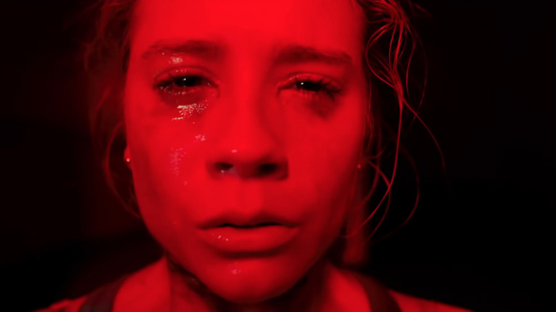 Crying girl in red light