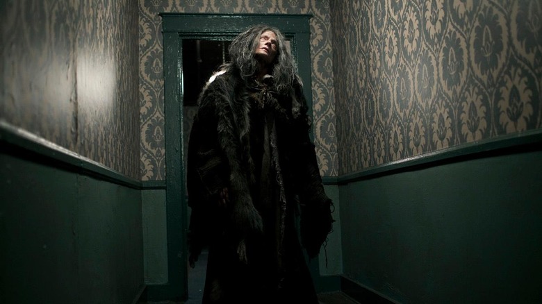 Creepy woman in a hallway