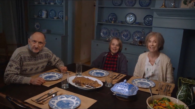 Child and grandparents having awkward dinner