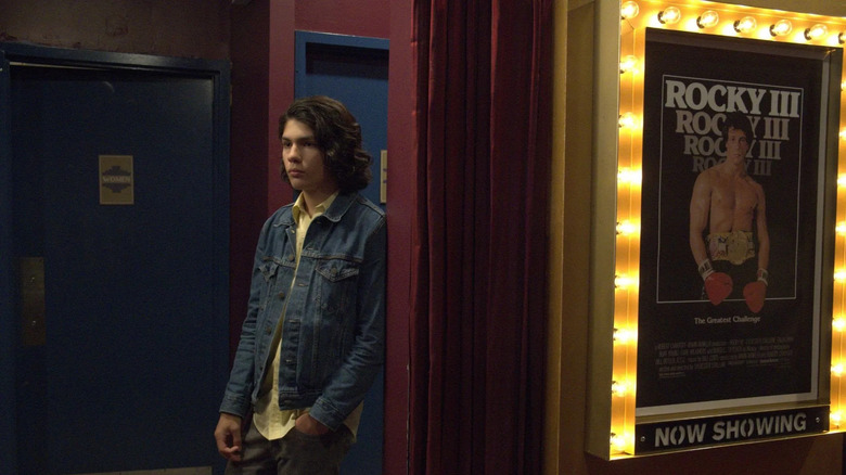 Lucius Hoyos standing outside a theater