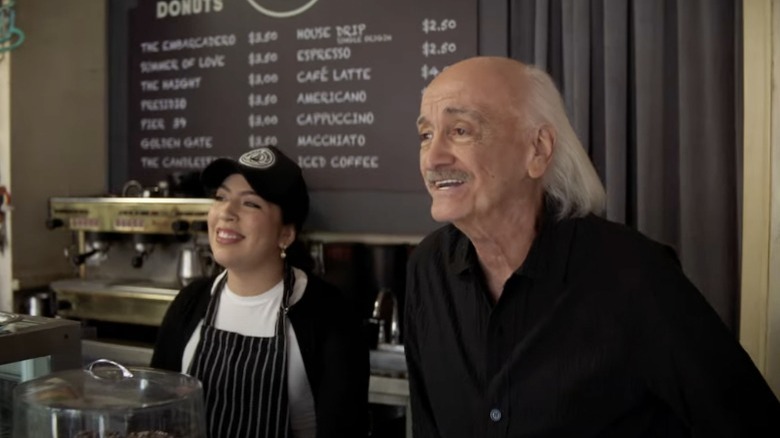 Ruben and a co-worker smile