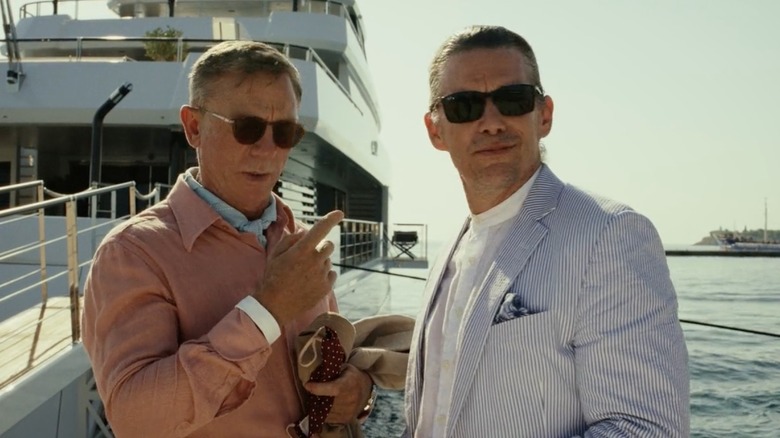 Ethan Hawke and Daniel Craig wearing suits and sunglasses