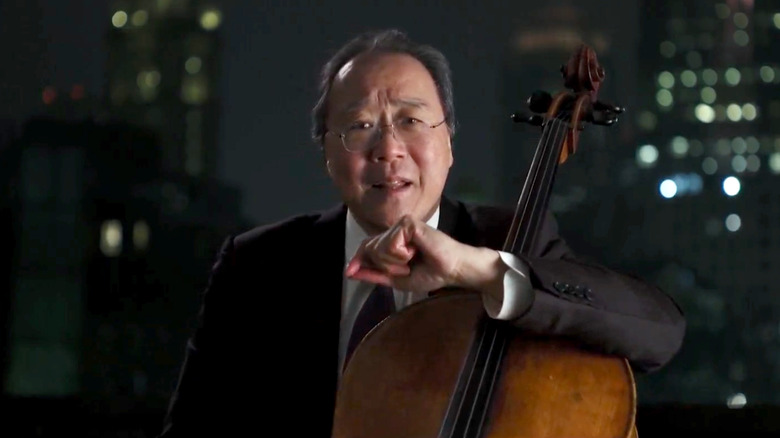 Yo-Yo Ma speaking while holding a cello