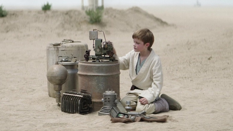 Young Luke Skywalker touching machine