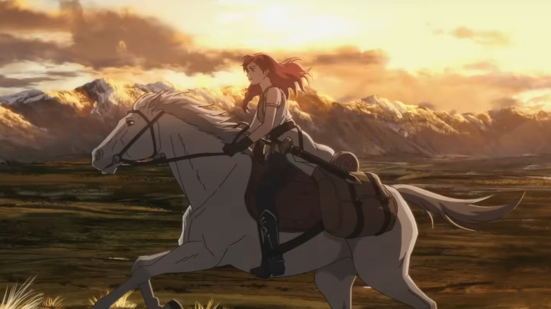 Hèra rides across the plains on a white horse in "The Lord of the Rings: The War of the Rohirrim" (2024)