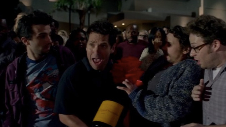 Paul Rudd carrying huge bottle of wine