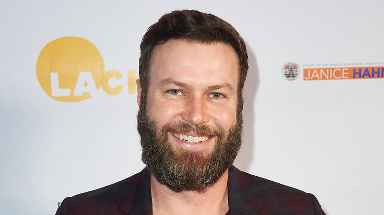 Taran Killam smiles