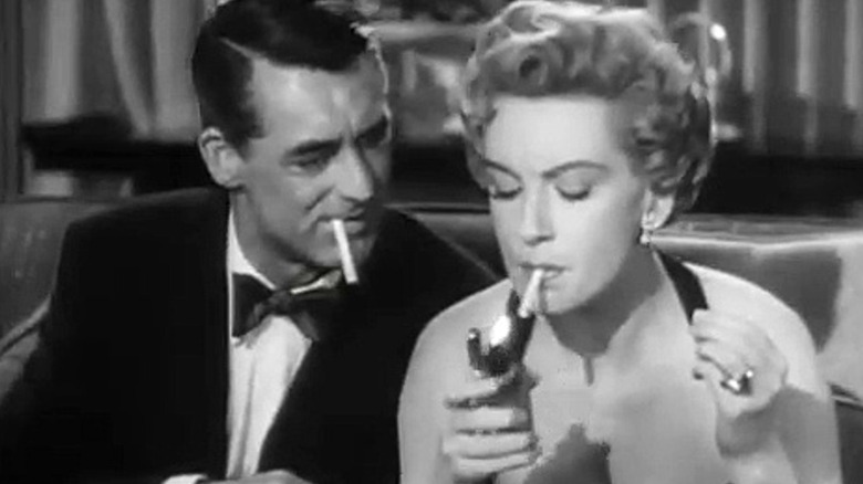 Cary Grant smoking with date