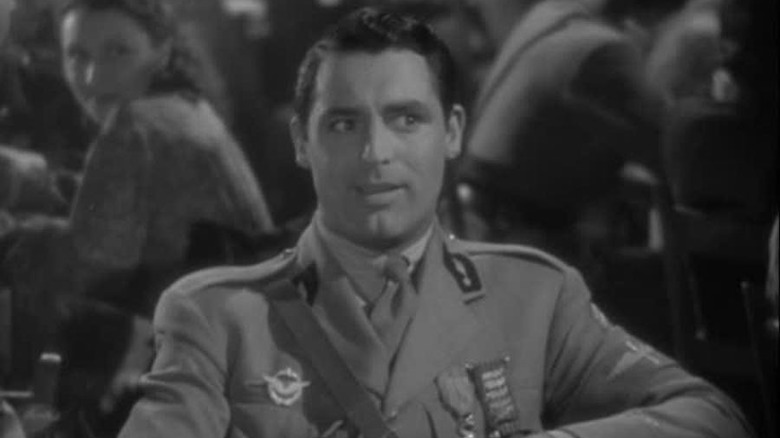 Cary Grant smiles in uniform