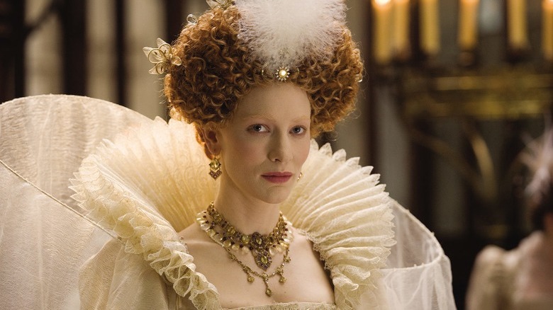 Cate Blanchett as Queen Elizabeth wearing curly red wig