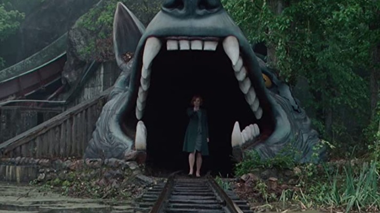 Marissa Wiegler standing in tunnel that looks like wolf's mouth