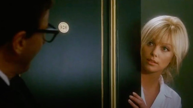 Theron looks behind a door