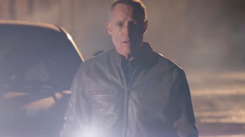 Hank Voight in car headlights