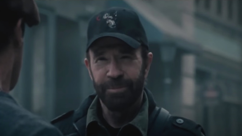 Chuck Norris wearing baseball hat