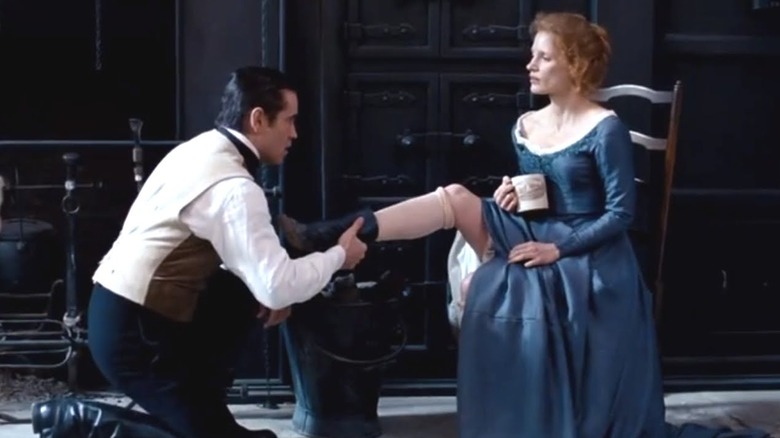 Colin Farrell helps Jessica Chastain with her boot in Miss Julie