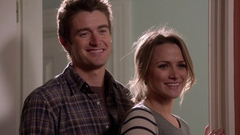 Clay and Quinn smile at Logan