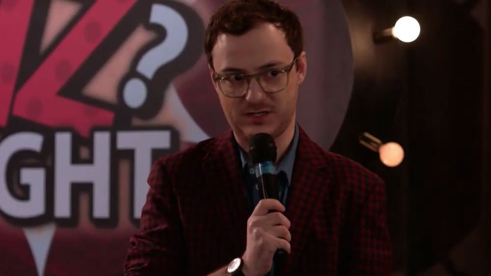 Griffin Newman as a quizmaster