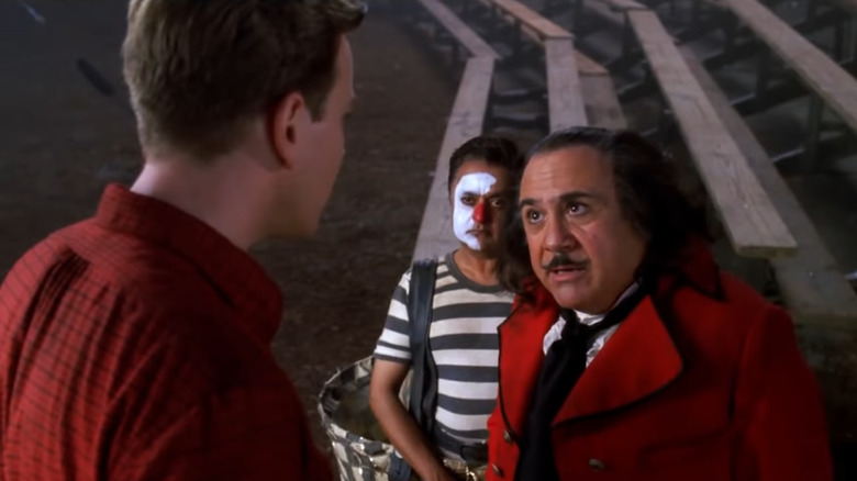 Danny DeVito and Deep Roy look up at Ewan McGregor