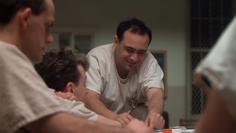 Danny DeVito plays cards with Christopher Lloyd and Brad Dourif