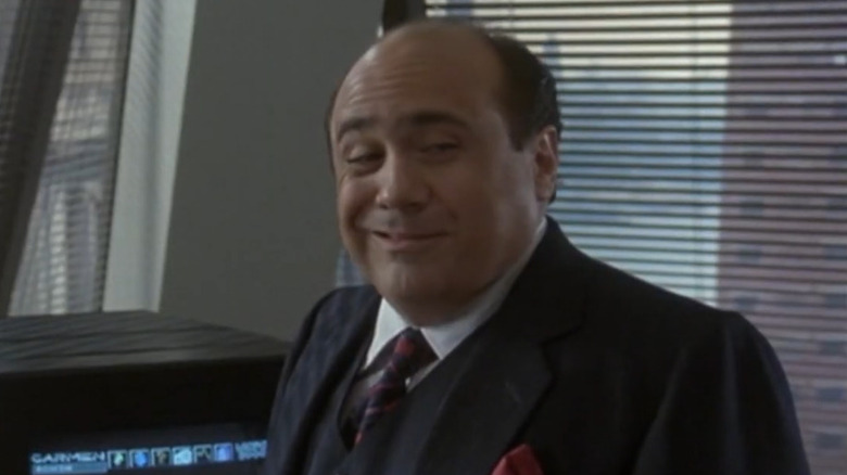 Danny DeVito smirks