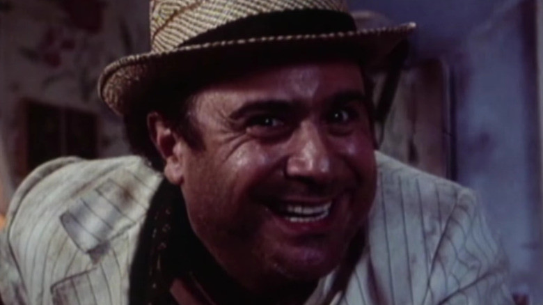 Danny DeVito grins