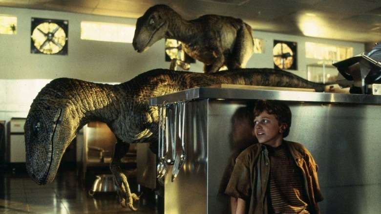 Velociraptors in the kitchen stalking a child