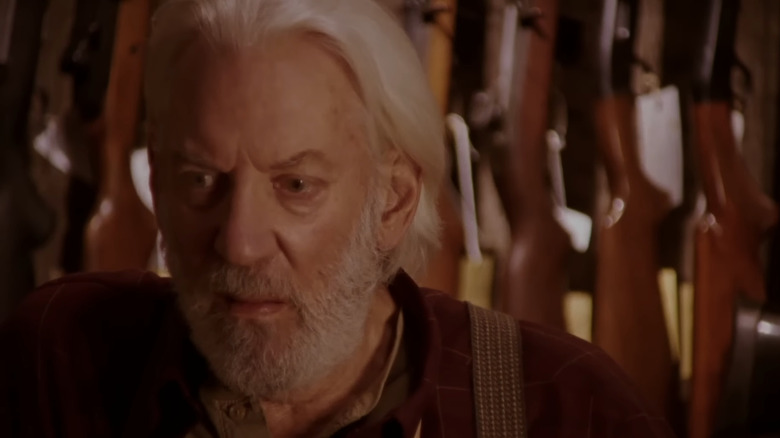 Donald Sutherland stands in gun shop