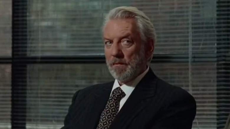 Donald Sutherland in suit at meeting