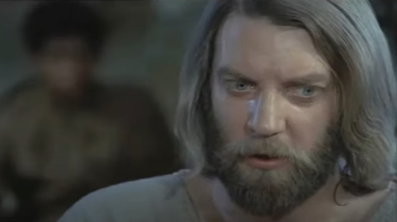 Donald Sutherland with brown beard and long hair