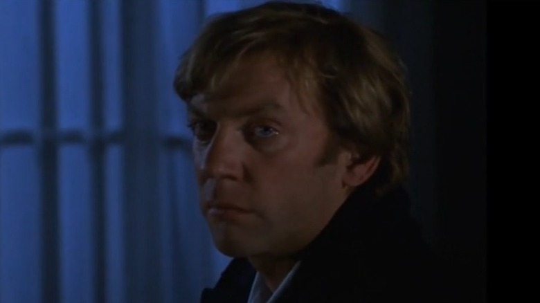 Donald Sutherland looking stern and sad