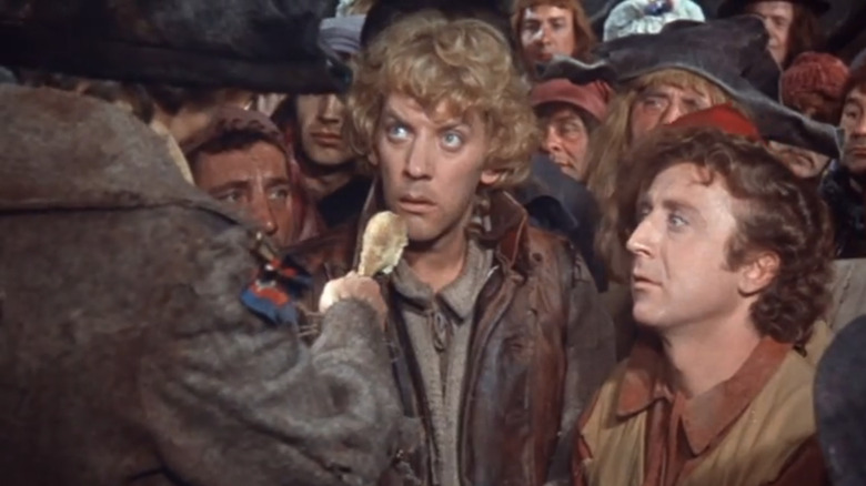 Donald Sutherland and Gene Wilder dressed as peasants