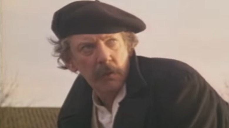 Donald Sutherland in beret and coat