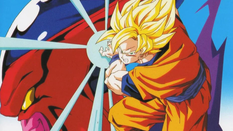 Goku charges a Kamehameha in front of Hatchiyack's head