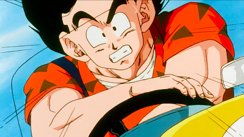 Goku frantically spinning a steering wheel