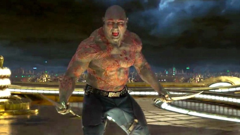 Drax wielding two knives