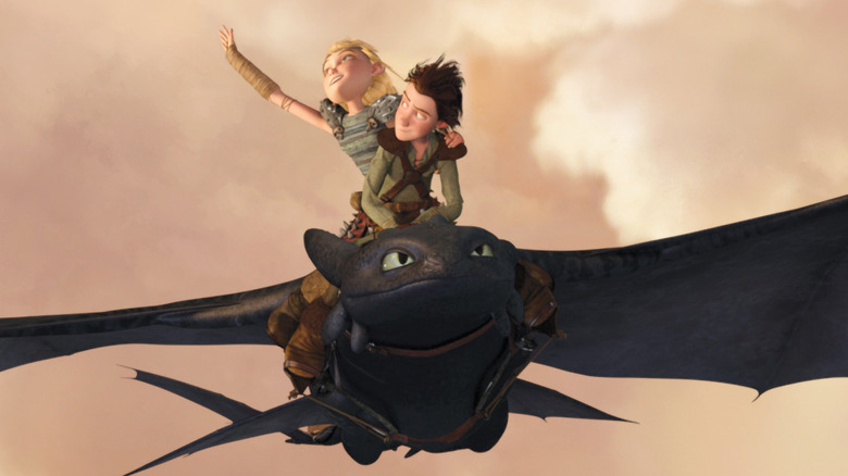 Hiccup, Astrid, and Toothless take flight