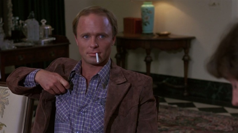 Ed Harris smokes a cigarette