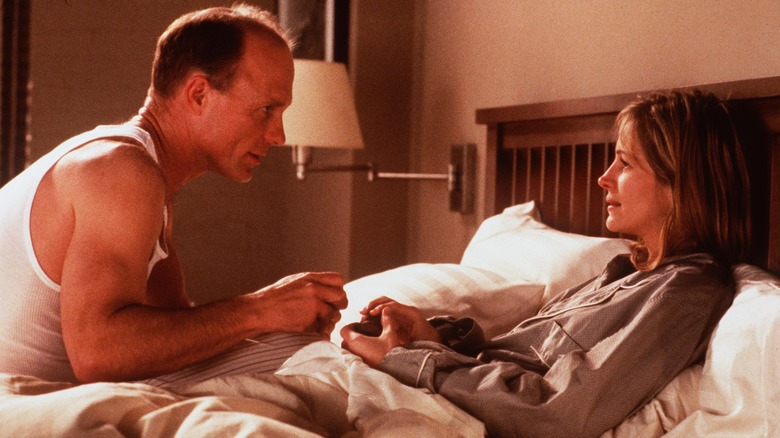 Ed Harris sits in bed with Julia Roberts