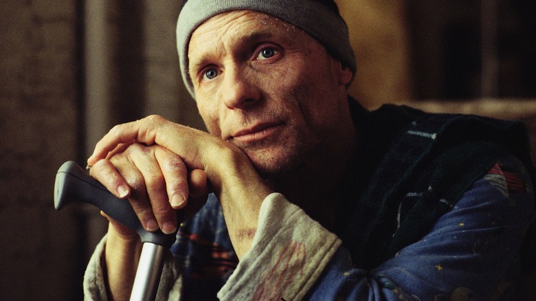 Ed Harris leans on a cane