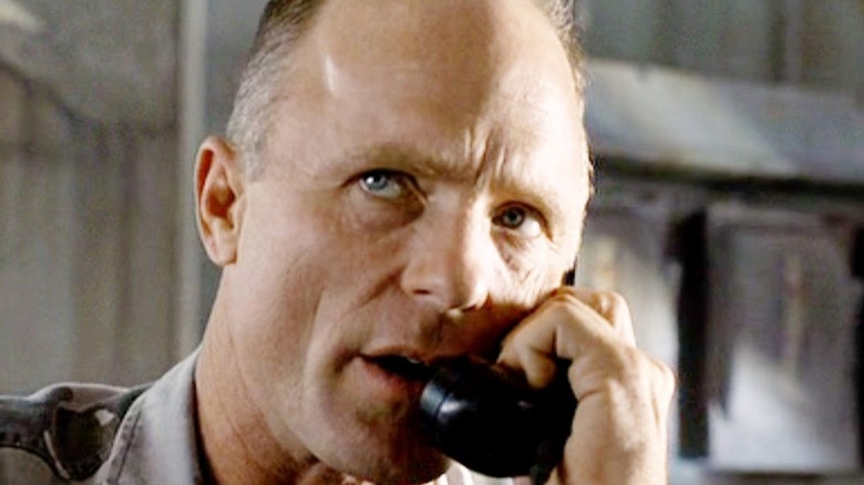 Ed Harris yells on the phone