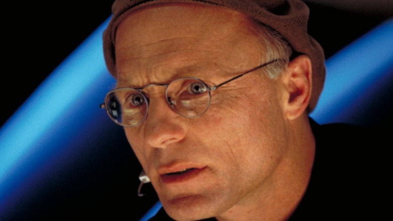 Ed Harris speaks in a headset