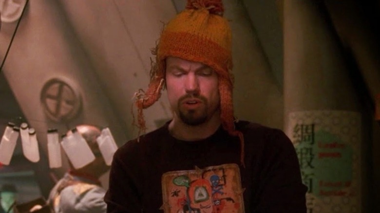 Jayne wears his trapper hat as he sits in his bunk