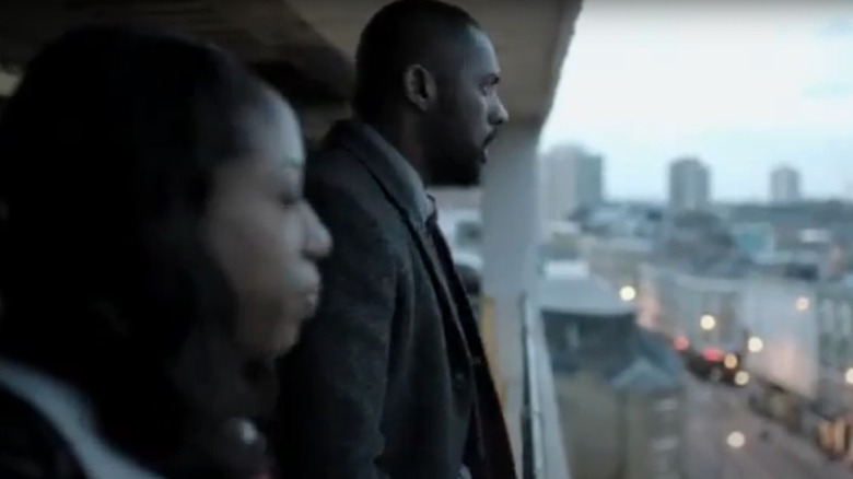 Luther and Grey on a balcony