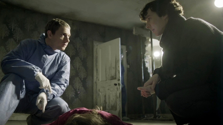 Watson and Sherlock with body