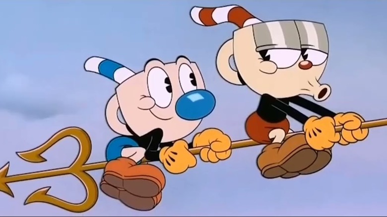 Cuphead and Mugman riding a pitchfork