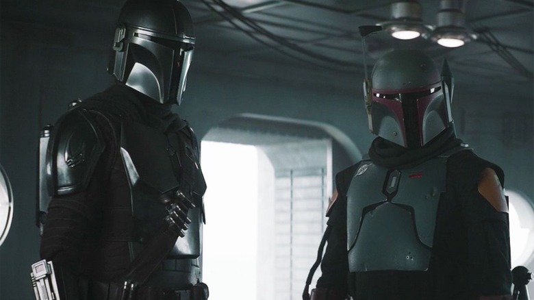 boba fett and the mandalorian standing