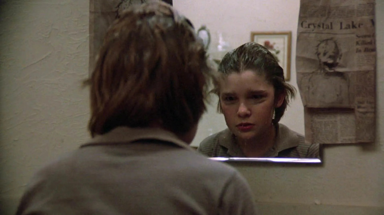 Young Tommy Jarvis looks in mirror in Friday the 13th: The Final Chapter (1984)