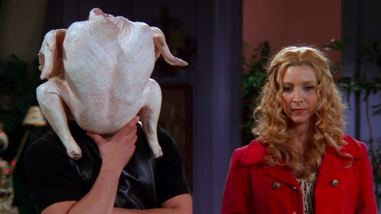 Phoebe and Joey with a turkey on his head 